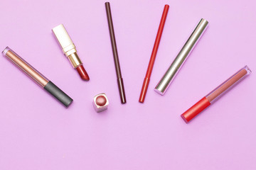 Items cosmetics for face on the lilac background