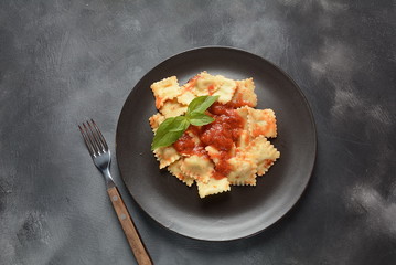 Ravioli with tomato sauce and basil, italian cuisine