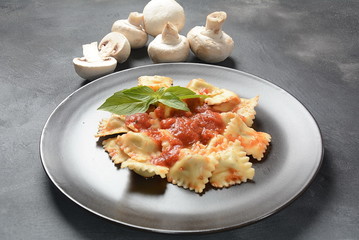 Ravioli with tomato sauce and basil, italian cuisine