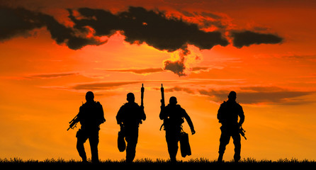  Navy seal silhouettes  on sunrise