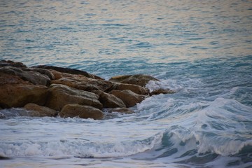 Sea waves crashing against coastline rocks nature scenery
