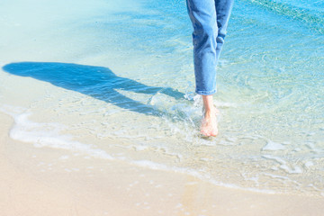 feet on a sandy beach, lifestyle