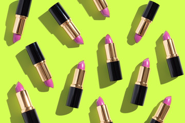 Obraz premium Set of color lipsticks on white background. Flat composition beauty, fashion. flat lay, top view