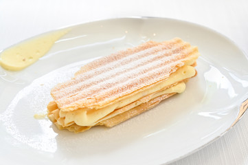 Vanilla mille feuille on white plate