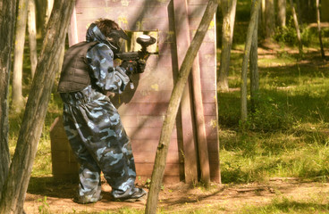 Paintball battle. The battlefield is equipped with barriers