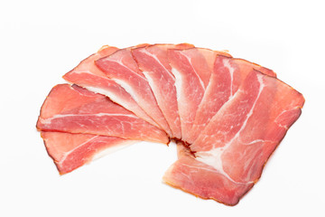 Hamon sliced on white background. Spanisch traditional meat.