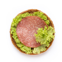 Sandwich with salami sausage on white background.