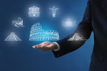 Businessman holding something on color background