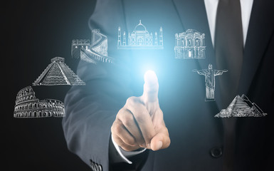 Businessman using virtual screen on dark background, closeup