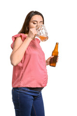 Pregnant woman drinking beer on white background