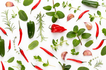 Spice herbal leaves and chili pepper on white background. Vegetables pattern. Floral and vegetables on white background. Top view, flat lay.