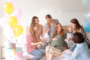 Fototapeta Beautiful pregnant woman and her friends at baby shower party obraz
