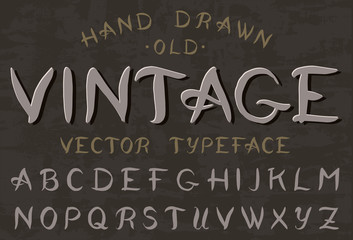 Calligraphic vintage font. Retro Capital letters.  Alphabet on dark background. Gothic Symbols types. Outlined version. 