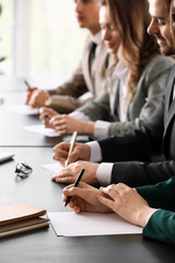 Human resources commission sitting at table in office during job interview