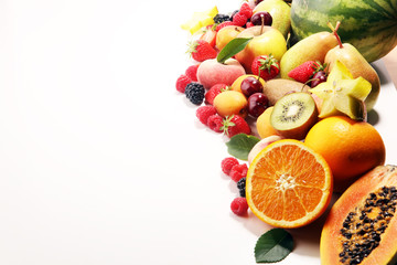 Fresh summer fruits with apple, peach, papaya, berries, pear and apricot.