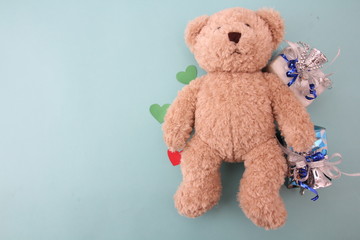 Teddy bear with blue background.
