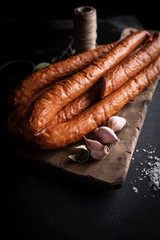 Sausage. A natural homely sausage in composition with herbs.