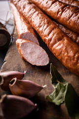 Thin sausage. Natural homely sausage in composition with spices