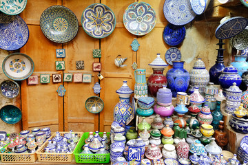Colorful crafts shop with ceramic art on a traditional moroccan market in medina of Fez, Morocco in Africa