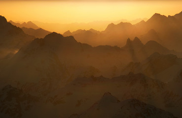 Naklejka premium Sunrise in the mountains landscape. Beautiful landscape with high mountains