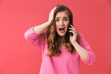 Beautiful young blonde girl standing