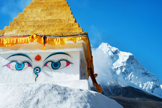 Stupa near Dingboche village with prayer flags and mounts Kangtega and Thamserku - way to mount Everest base camp