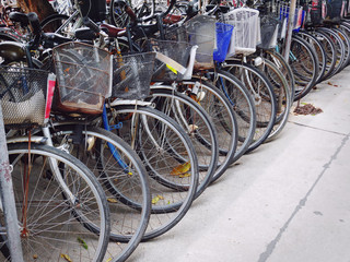 Row of Old Bicycles Parking on Street