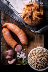 Sausage and bread, traditional peasant food. Home cooking.