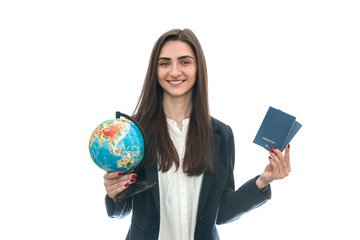 Fototapeta premium Woman with globe and passports isolated on white