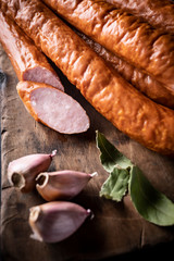 Thin sausage. Natural homely sausage in composition with spices