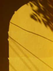 abstract shadow on yellow wall