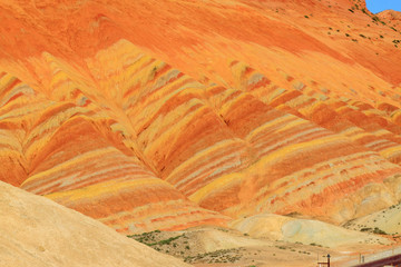 Striped rainbow mountains during sunset