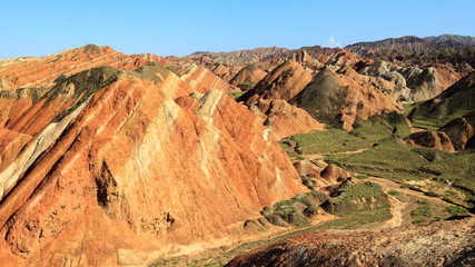 Stunning rainbow hills with a clear sky during a summer day