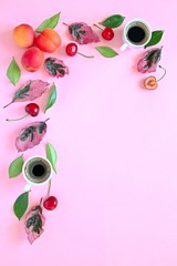 Coffee with fruits and follies on pink background. Top view with copy space. Flet lay style. Summer concept. © Ale02