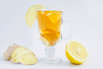 Tea with lemon and ginger on a white background
