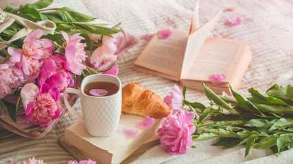 Obraz na płótnie Canvas drink, reserve, pions, bright, concept, copy, cup, diary, fresh, herbal, life, book, tea, romantic concept, sun, vintage style, read, day, good, pions flowers, croissant, string b