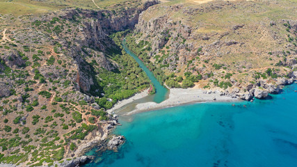 Aerial drone panoramic view of Preveli paradise palm beach and lagoon with Palm trees in the South from city of Rethymno, Crete, Greece