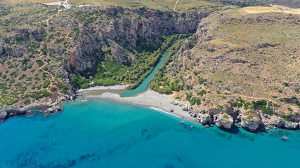 Aerial drone panoramic view of Preveli paradise palm beach and lagoon with Palm trees in the South from city of Rethymno, Crete, Greece