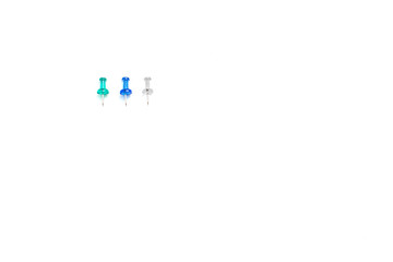 Blue, turquoise and transparent buttons are beautifully laid out in a row on a white isolated background. Top view, with space for text.