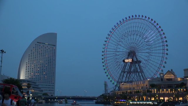 YOKOHAMA, KANAGAWA, JAPAN - 2 JUNE 2019 : Scenery of ferris wheel and sea near Minatomirai station in Yokohama city.