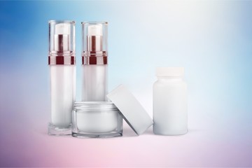 Set of cosmetic products in white containers isolated