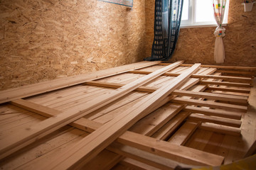 Fototapeta na wymiar Wooden planks on a construction site. Neatly folded. 