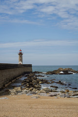 View from Carneiro beach in Porto to pier and lighthouse Felgueiras.