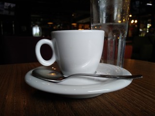 cup of coffee on wooden table