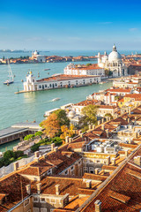 Aerial view of Venice, Santa Maria della Salute and Piazza San Marco during early morning summer day. World famous Venice landmarks. View from St Mark Campanile.