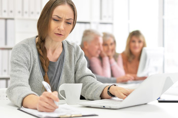 Portrait of group of active business people working