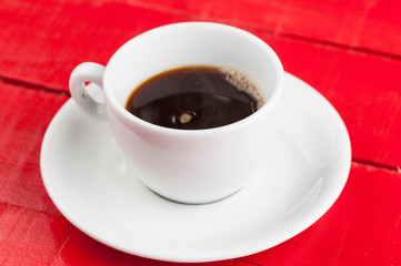 White coffee cup with  isolated on a red background.