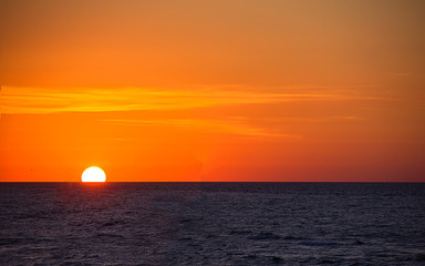 sunrise over the sea, horizon line, bright beautiful sky, sea vacation