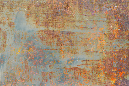 Grunge metal coroded texture. Old rusty metal plate heavily aged corrosion stain creates a grungy frame. © banphote