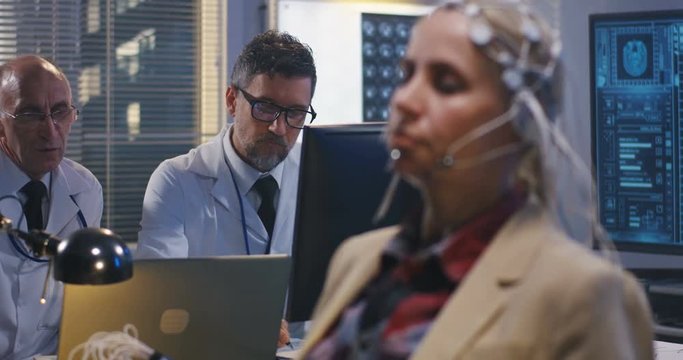 Patient sitting with eyes closed during EEG examination